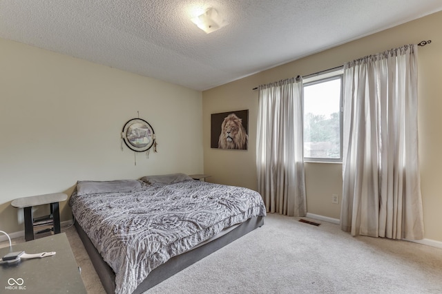 5335 Honey Comb Ln, Indianapolis, IN 46221 - bedroom featuring carpet flooring, a textured ceiling, and baseboards