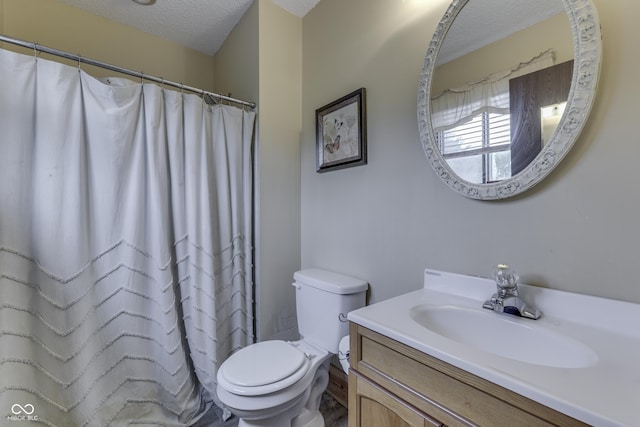 5335 Honey Comb Ln, Indianapolis, IN 46221 - full bath featuring a textured ceiling, toilet, vanity, and a shower with shower curtain
