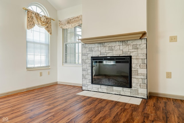 5839 Quail Run Dr, Indianapolis, IN 46237 - room details with baseboards, a fireplace, and wood finished floors