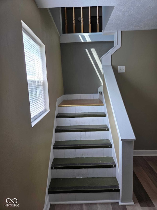 2819 W 16th St, Indianapolis, IN 46222 - staircase with baseboards and wood finished floors