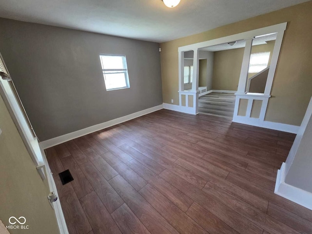 2819 W 16th St, Indianapolis, IN 46222 - spare room featuring baseboards, visible vents, and dark wood-type flooring