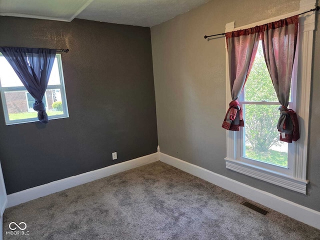 2819 W 16th St, Indianapolis, IN 46222 - carpeted spare room featuring baseboards and visible vents