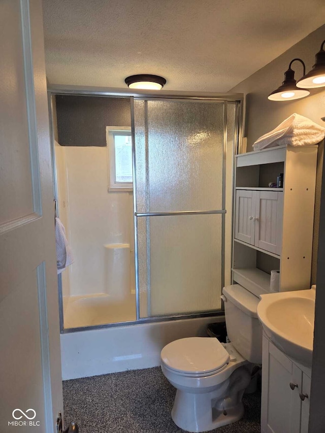 2819 W 16th St, Indianapolis, IN 46222 - full bathroom featuring vanity, a textured ceiling, shower / bath combination with glass door, and toilet