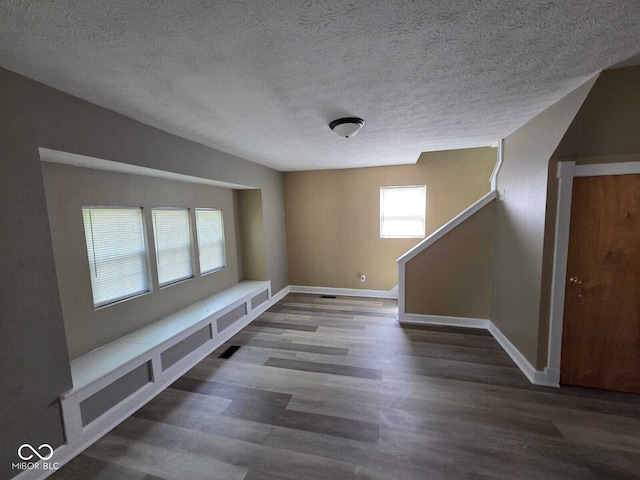 2819 W 16th St, Indianapolis, IN 46222 - interior space with baseboards, a textured ceiling, wood finished floors, and visible vents