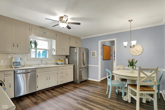 12669 Brookshire Pkwy, Carmel, IN 46033 - kitchen with appliances with stainless steel finishes, a sink, light countertops, ceiling fan with notable chandelier, and tasteful backsplash