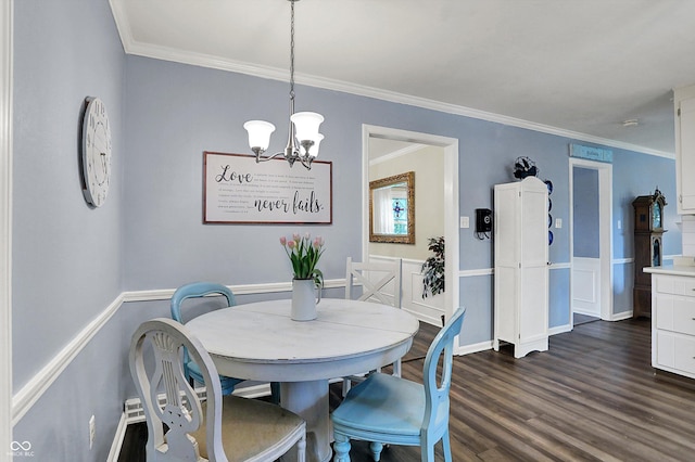 12669 Brookshire Pkwy, Carmel, IN 46033 - dining area featuring an inviting chandelier, wainscoting, crown molding, and dark wood-style floors