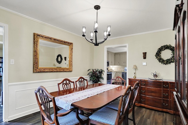 12669 Brookshire Pkwy, Carmel, IN 46033 - dining area with wainscoting, a chandelier, dark wood finished floors, and ornamental molding