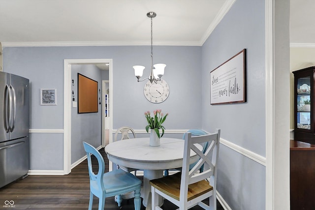12669 Brookshire Pkwy, Carmel, IN 46033 - dining room featuring baseboards, an inviting chandelier, ornamental molding, and dark wood finished floors