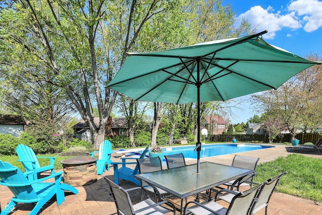 12669 Brookshire Pkwy, Carmel, IN 46033 - view of patio / terrace featuring a fenced in pool, outdoor dining area, a fenced backyard, and an outdoor fire pit