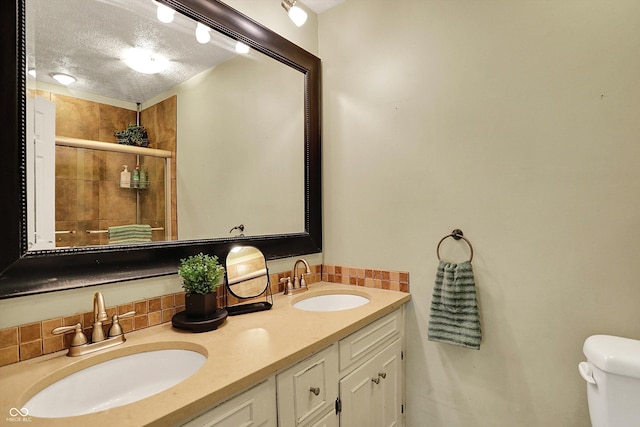 12669 Brookshire Pkwy, Carmel, IN 46033 - full bath with toilet, a textured ceiling, a shower stall, and a sink