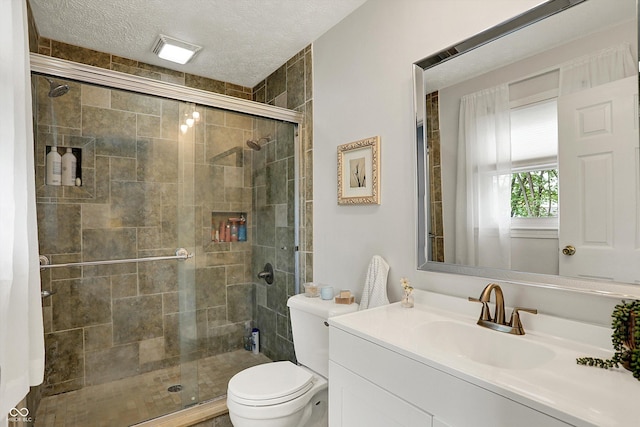12669 Brookshire Pkwy, Carmel, IN 46033 - full bath featuring vanity, toilet, a textured ceiling, and a stall shower