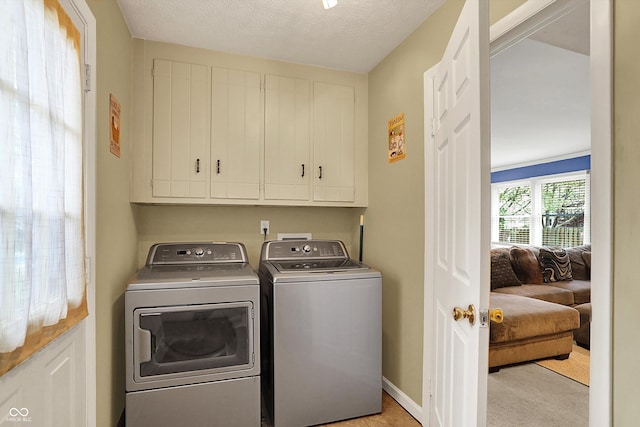 12669 Brookshire Pkwy, Carmel, IN 46033 - washroom featuring separate washer and dryer, cabinet space, and baseboards