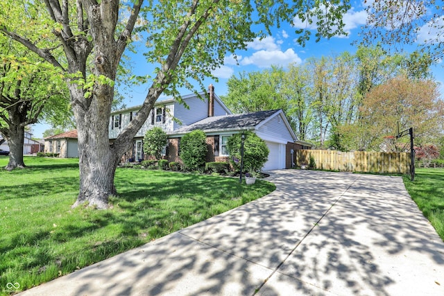 12669 Brookshire Pkwy, Carmel, IN 46033 - traditional home featuring fence, an attached garage, brick siding, a front yard, and concrete driveway