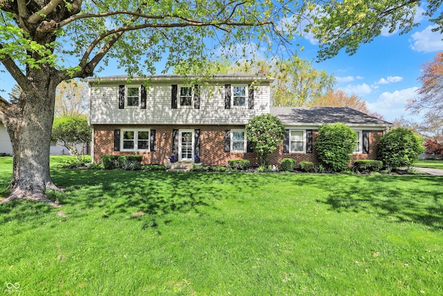 12669 Brookshire Pkwy, Carmel, IN 46033 - colonial home with brick siding and a front lawn