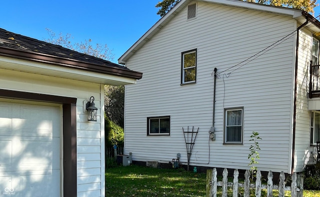 view of property exterior with a yard