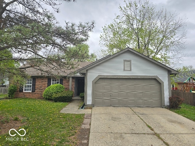 9118 Lansburgh Ct, Indianapolis, IN 46234 - ranch-style home with fence, concrete driveway, a front lawn, and a garage