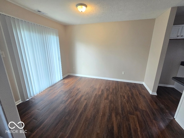 9118 Lansburgh Ct, Indianapolis, IN 46234 - unfurnished dining area with baseboards, visible vents, and dark wood-style floors