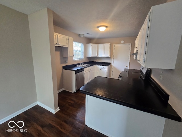 9118 Lansburgh Ct, Indianapolis, IN 46234 - kitchen with stainless steel dishwasher, dark countertops, a sink, white cabinetry, and stove