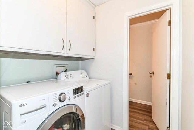 7140 Avalon Trail Dr, Indianapolis, IN 46250 - laundry area featuring cabinet space, washing machine and clothes dryer, wood finished floors, and baseboards