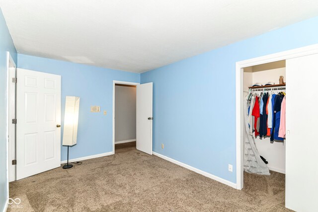 7140 Avalon Trail Dr, Indianapolis, IN 46250 - unfurnished bedroom featuring carpet flooring, a closet, and baseboards