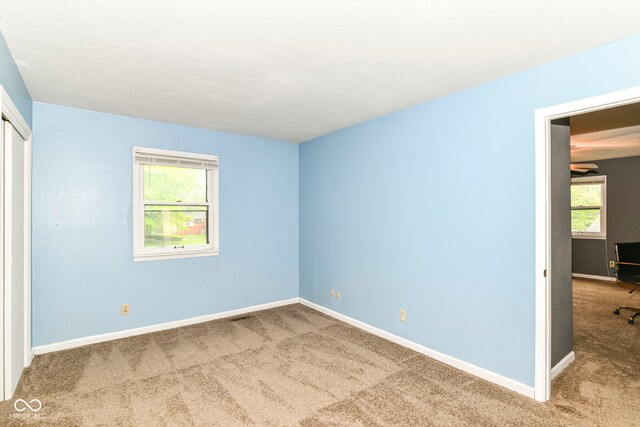 7140 Avalon Trail Dr, Indianapolis, IN 46250 - unfurnished bedroom with carpet floors, a closet, and baseboards