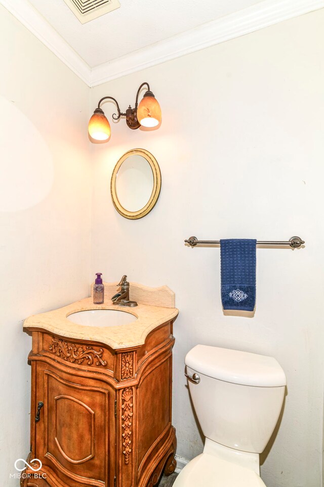 7140 Avalon Trail Dr, Indianapolis, IN 46250 - bathroom with toilet, vanity, and ornamental molding