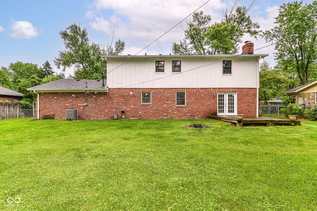 7140 Avalon Trail Dr, Indianapolis, IN 46250 - rear view of property featuring central AC unit, french doors, a chimney, and brick siding
