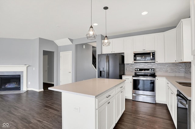6827 Fallen Leaf Dr, Whitestown, IN 46075 - kitchen with stainless steel appliances, open floor plan, backsplash, dark wood-type flooring, and light countertops