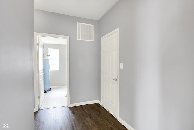 6827 Fallen Leaf Dr, Whitestown, IN 46075 - corridor featuring wood finished floors and water heater