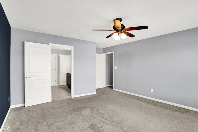 6827 Fallen Leaf Dr, Whitestown, IN 46075 - unfurnished bedroom featuring carpet flooring, connected bathroom, and ceiling fan