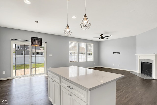 6827 Fallen Leaf Dr, Whitestown, IN 46075 - kitchen featuring dark wood finished floors, open floor plan, ceiling fan, white cabinets, and recessed lighting