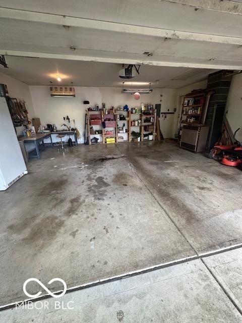 garage featuring a workshop area and a garage door opener