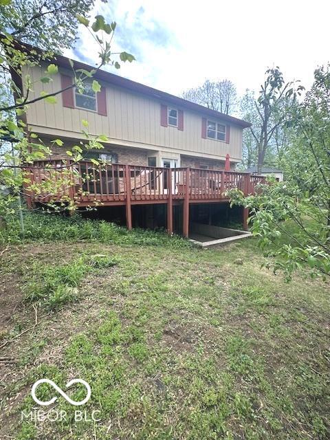 rear view of house with a wooden deck