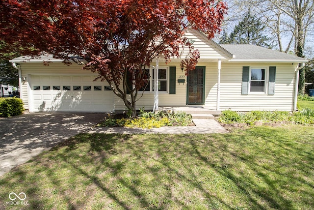 view of front of house featuring a garage, a front lawn, driveway, and covered porch