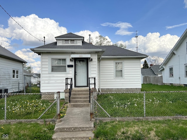3434 Forrest Ter, Anderson Se, IN 46013 - bungalow featuring a gate, a front yard, a shingled roof, and a fenced front yard