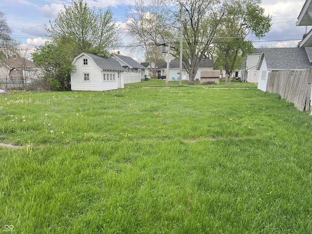 3434 Forrest Ter, Anderson Se, IN 46013 - view of yard featuring fence, an outdoor structure, and a residential view