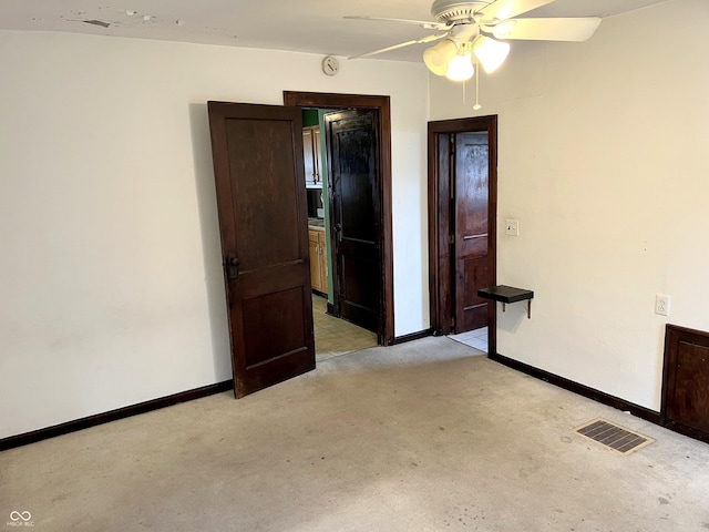 3434 Forrest Ter, Anderson Se, IN 46013 - empty room featuring a ceiling fan, visible vents, light colored carpet, and baseboards