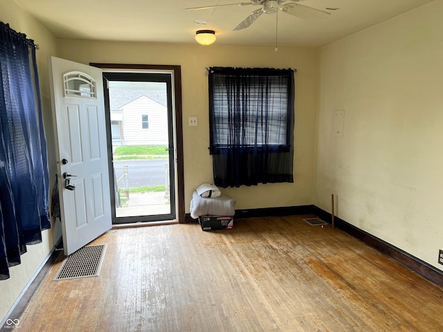 3434 Forrest Ter, Anderson Se, IN 46013 - foyer entrance with wood finished floors, ceiling fan, visible vents, and baseboards
