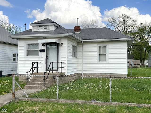 3434 Forrest Ter, Anderson Se, IN 46013 - bungalow-style home featuring a chimney, roof with shingles, central air condition unit, a front yard, and a fenced front yard