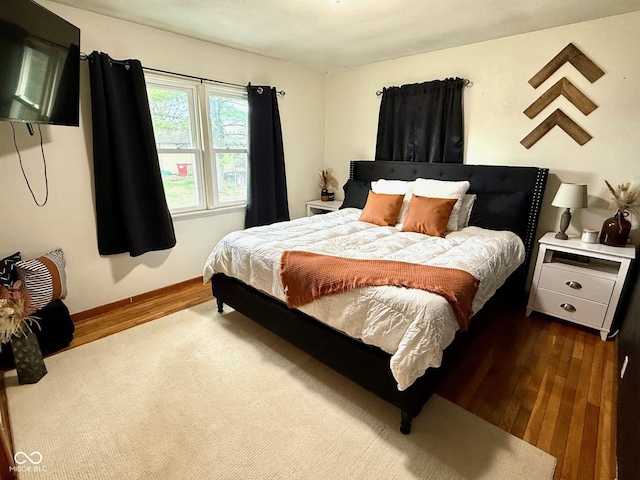 bedroom featuring dark wood-type flooring
