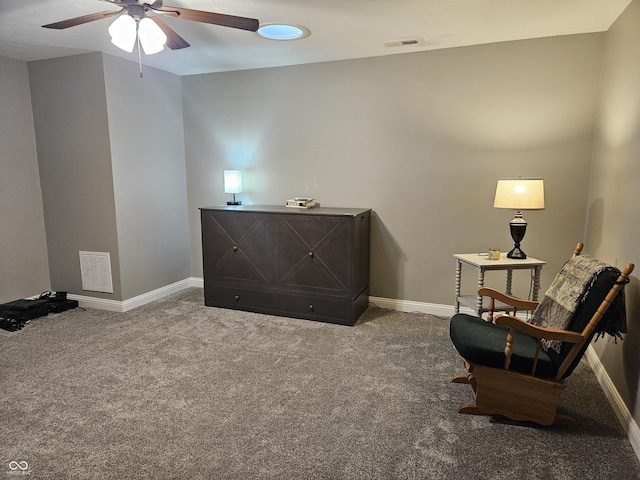 living area featuring carpet floors, baseboards, and visible vents
