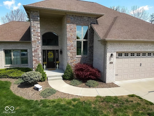 doorway to property with brick siding, an attached garage, and a shingled roof