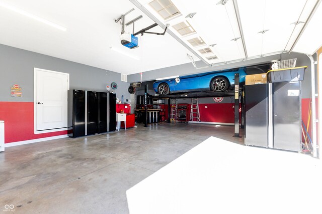 garage featuring baseboards and a garage door opener