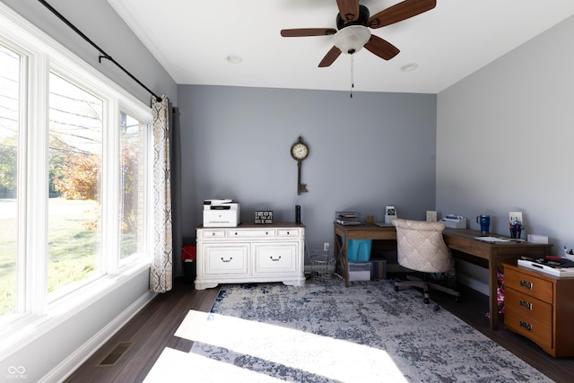 office area with baseboards, a ceiling fan, dark wood-style flooring, and visible vents