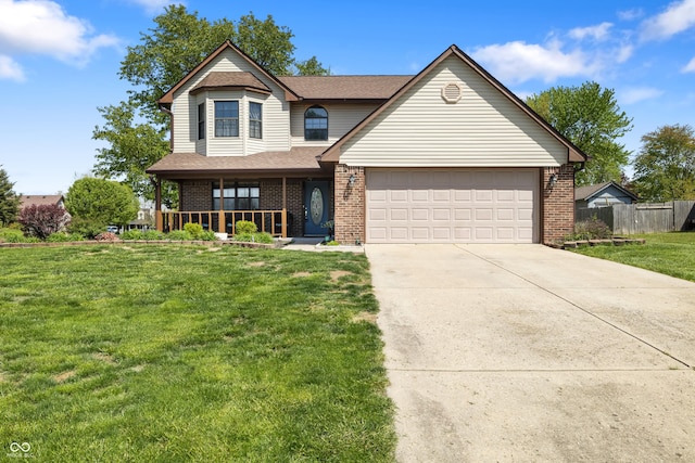 traditional-style house featuring covered porch, a front yard, a garage, brick siding, and fence