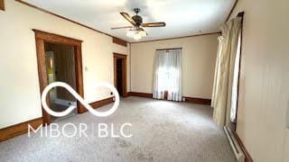 unfurnished bedroom with baseboards and carpet flooring