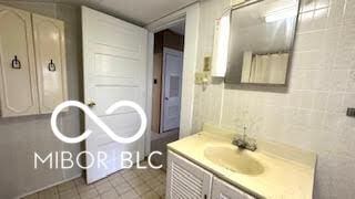 bathroom with vanity and tile patterned floors