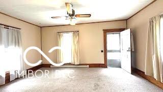 unfurnished room featuring baseboards