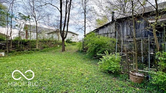 view of yard featuring a barn and an outdoor structure
