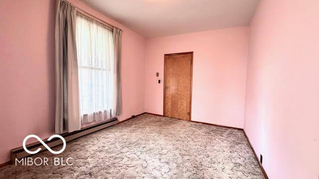 unfurnished room with carpet